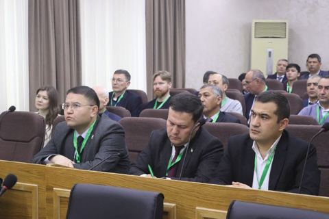 Participants seated in a forum hall