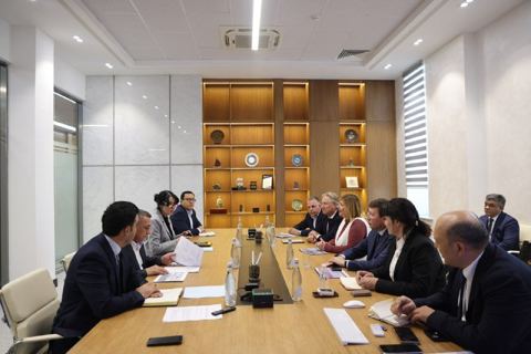 Officials meeting at a long table