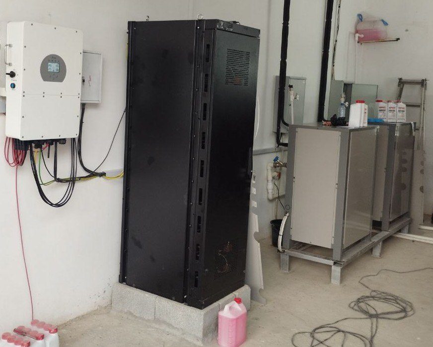 Battery storage cabinet and inverter mounted on a wall